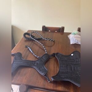 X-Large Dog coat and accessories, including two leashes and a large harness.